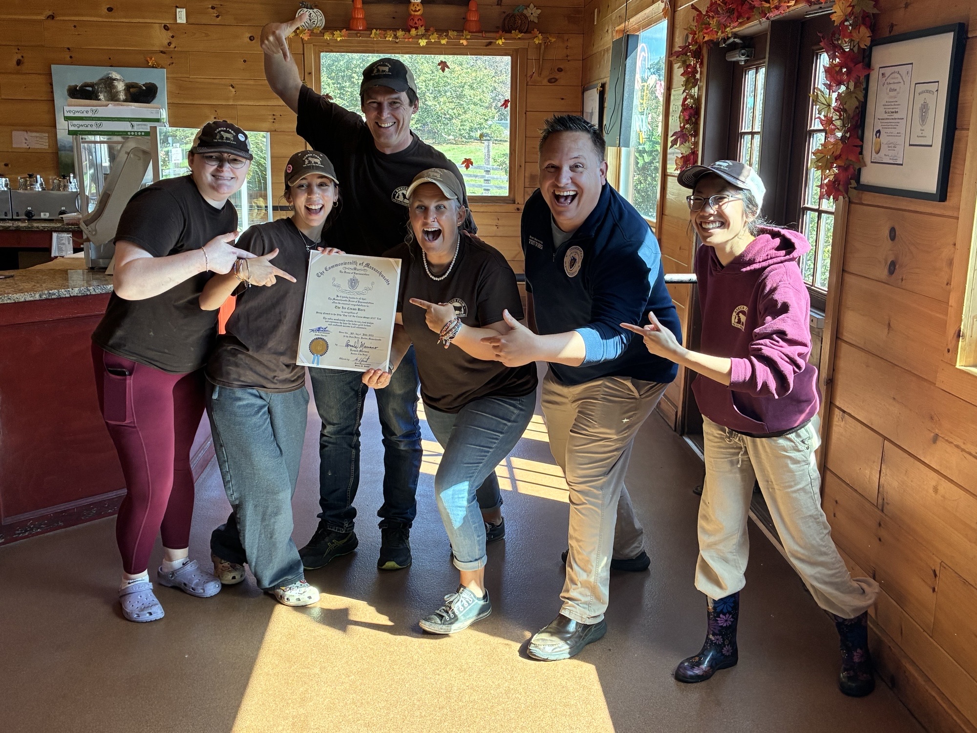 Justin Thurber presenting a Commonwealth citation to the team at a local farm business