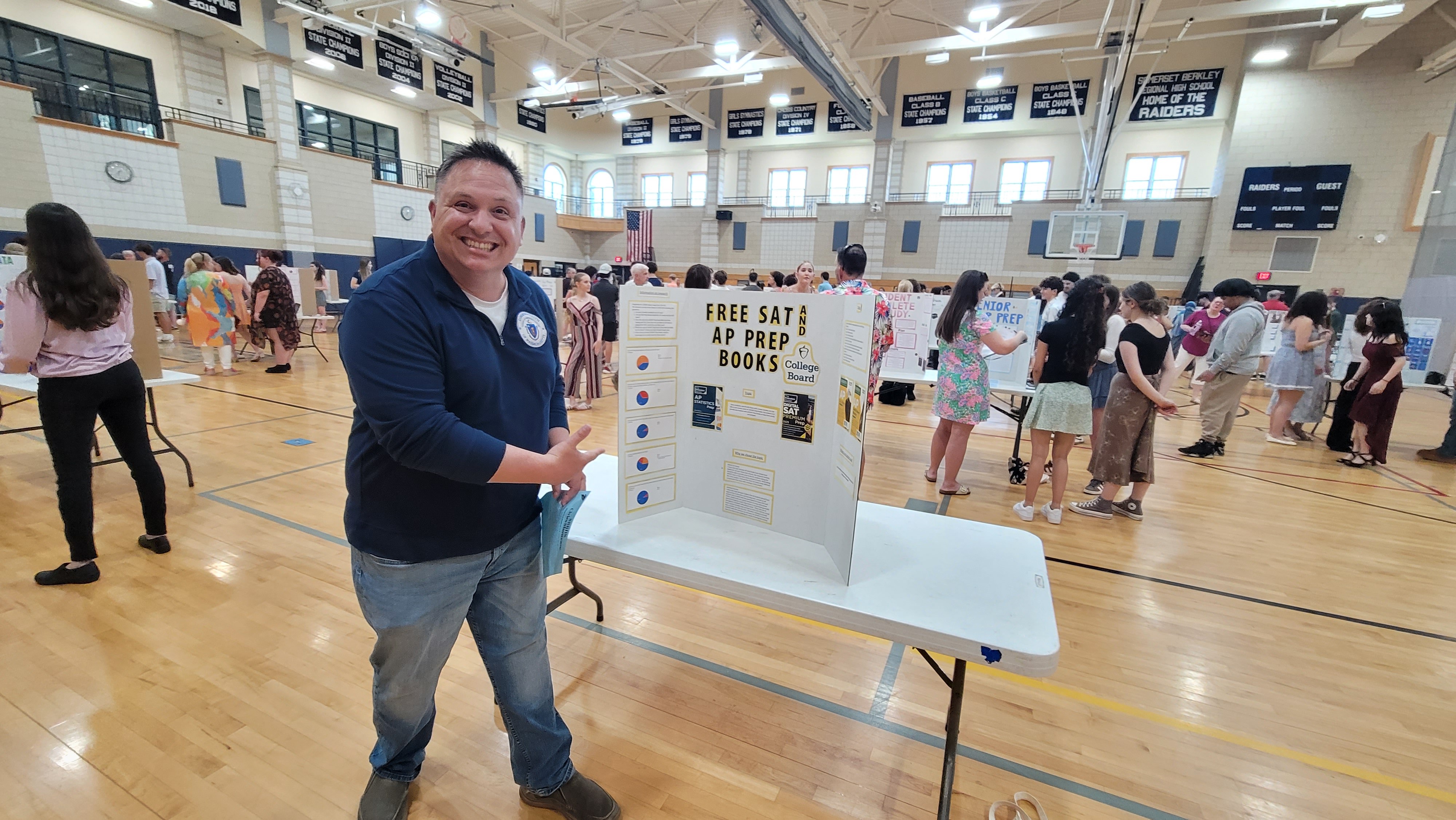 Justin Thurber at a Somerset Berkley student fair promoting free SAT and AP prep books